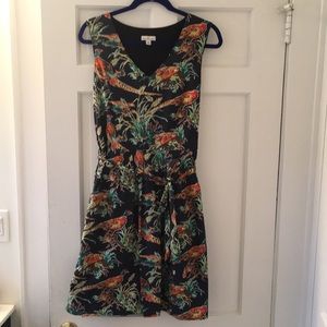 Navy blue dress with pattern. Sleeveless cotton v-neck with tie around waist